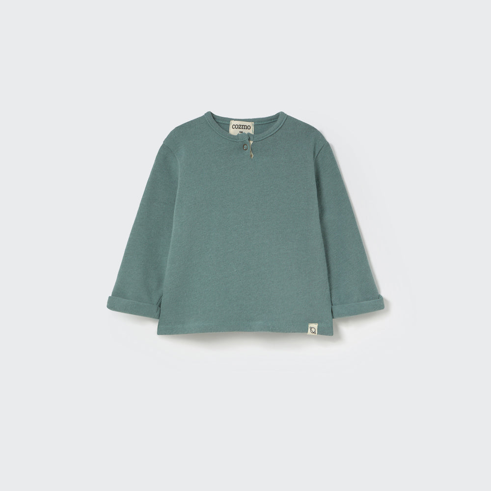 Green long-sleeve shirt on a light gray background